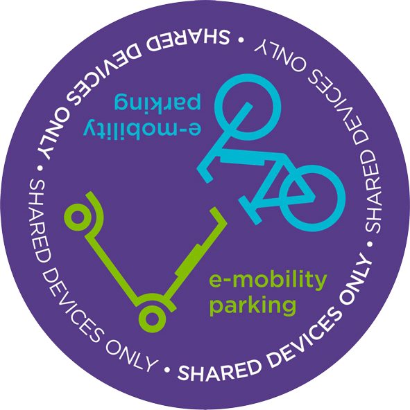 Round purple sticker with an illustration of a scooter and a bicycle, indicating where you can park e-scooters and e-bikes on campus
