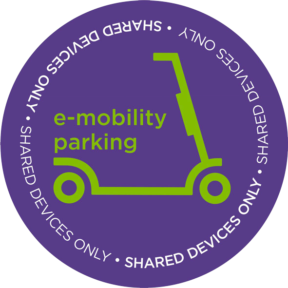 Round purple sticker with an illustration of a scooter, indicating where you can park e-scooters on campus