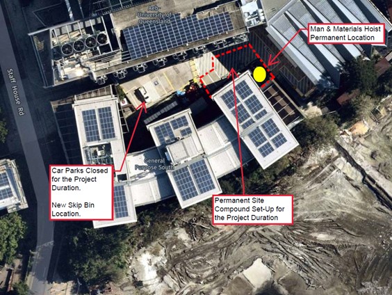 A aerial view of a building with solar panelsDescription automatically generated