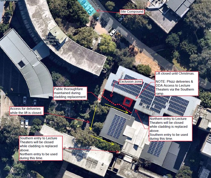 Aerial view of a building with solar panelsDescription automatically generated